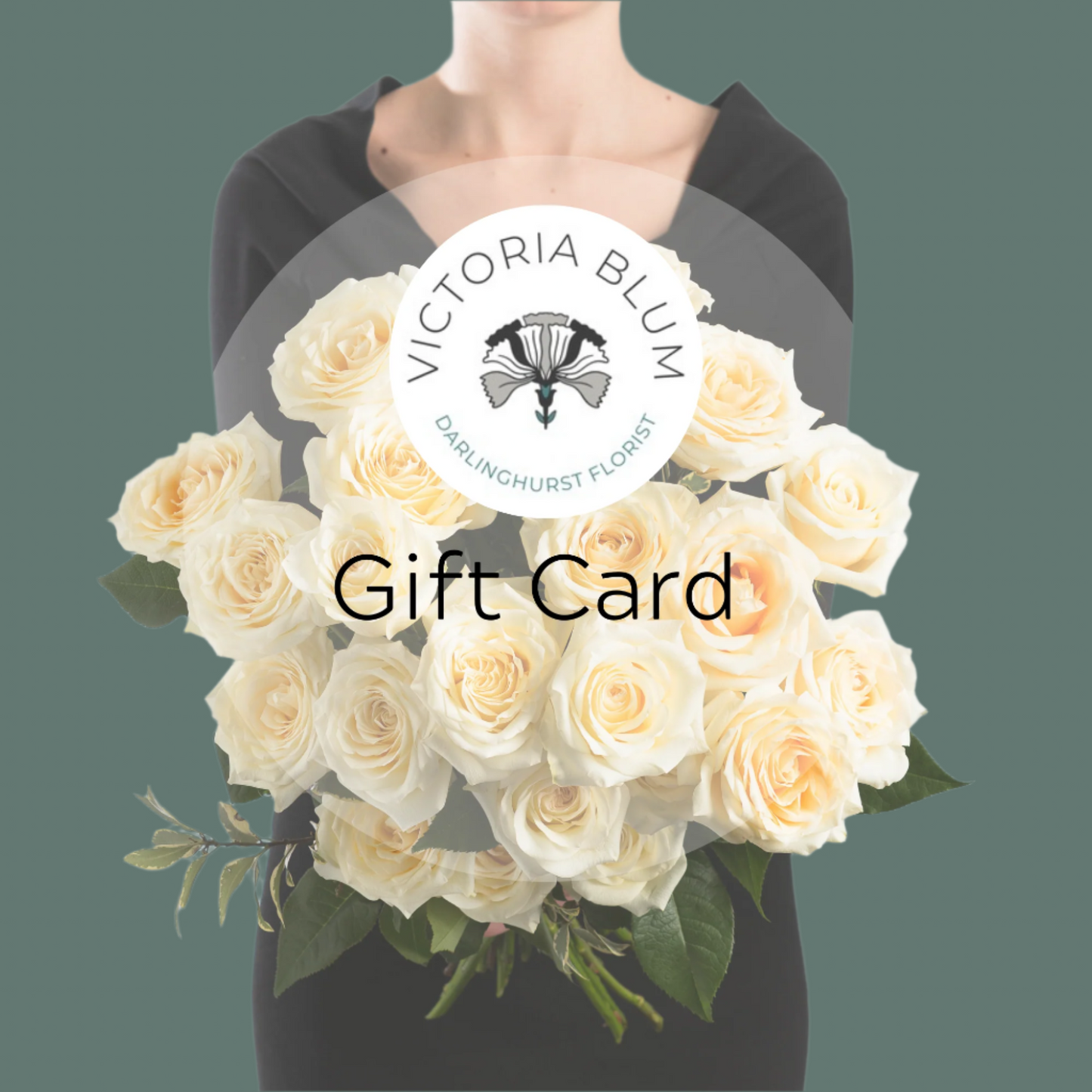 A person holding a bouquet of white roses with the Victoria Blum logo and the text 'Gift Card' displayed prominently in the center.